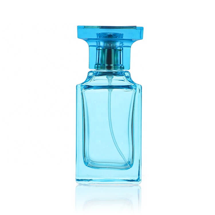 mėlynas kvepalų stiklinis buteliukas